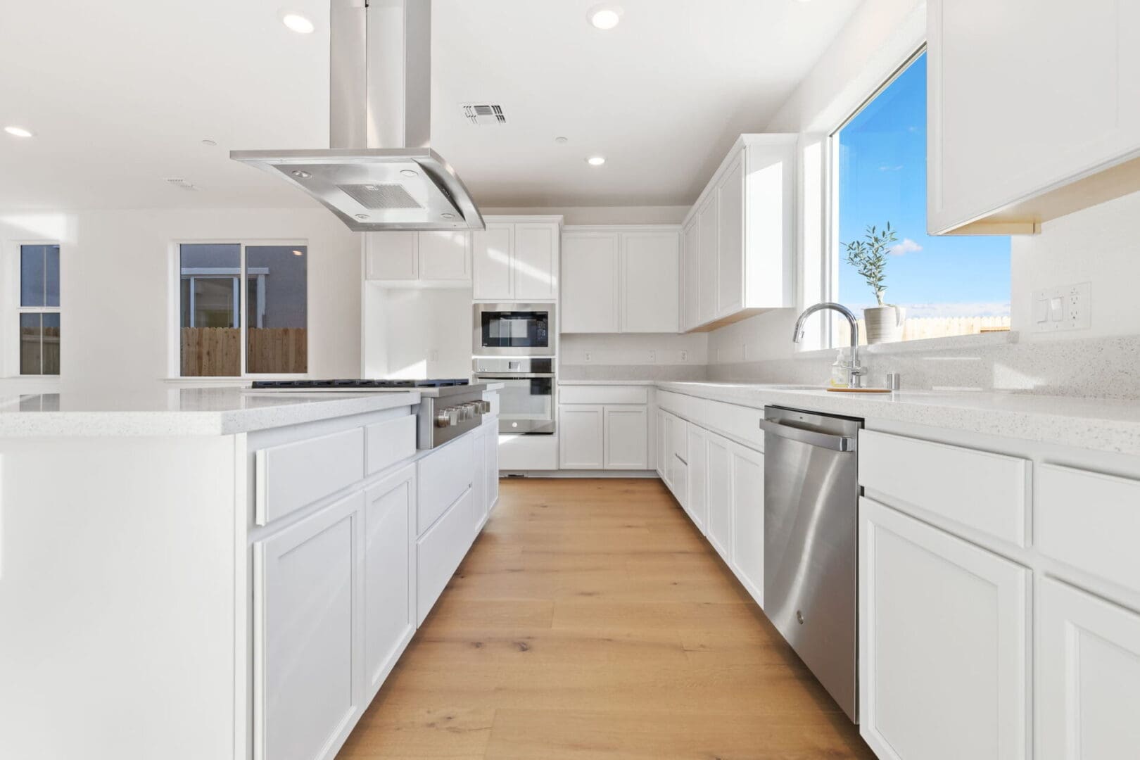 Modern kitchen with white cabinets and island.