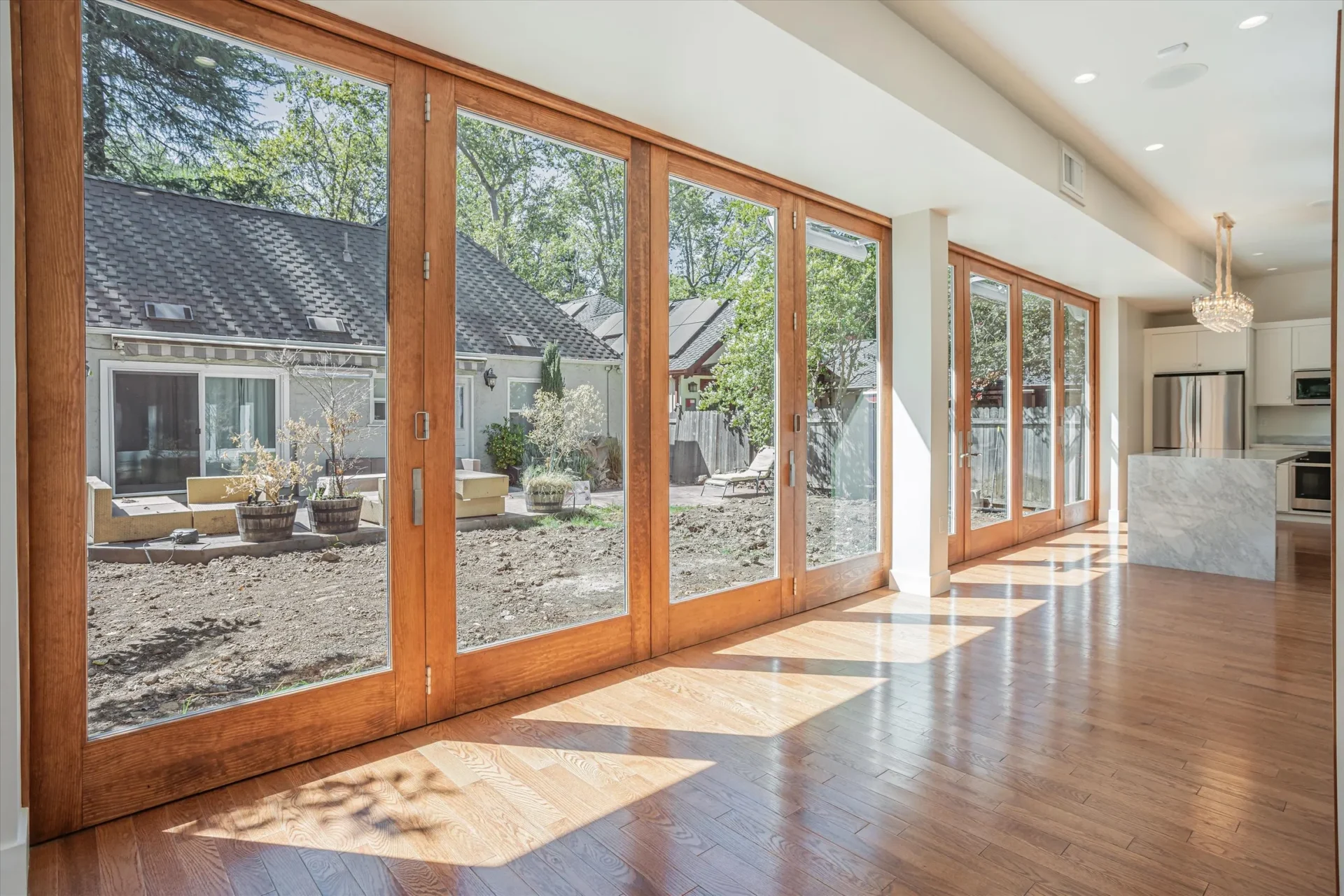 Spacious room with large glass sliding doors.