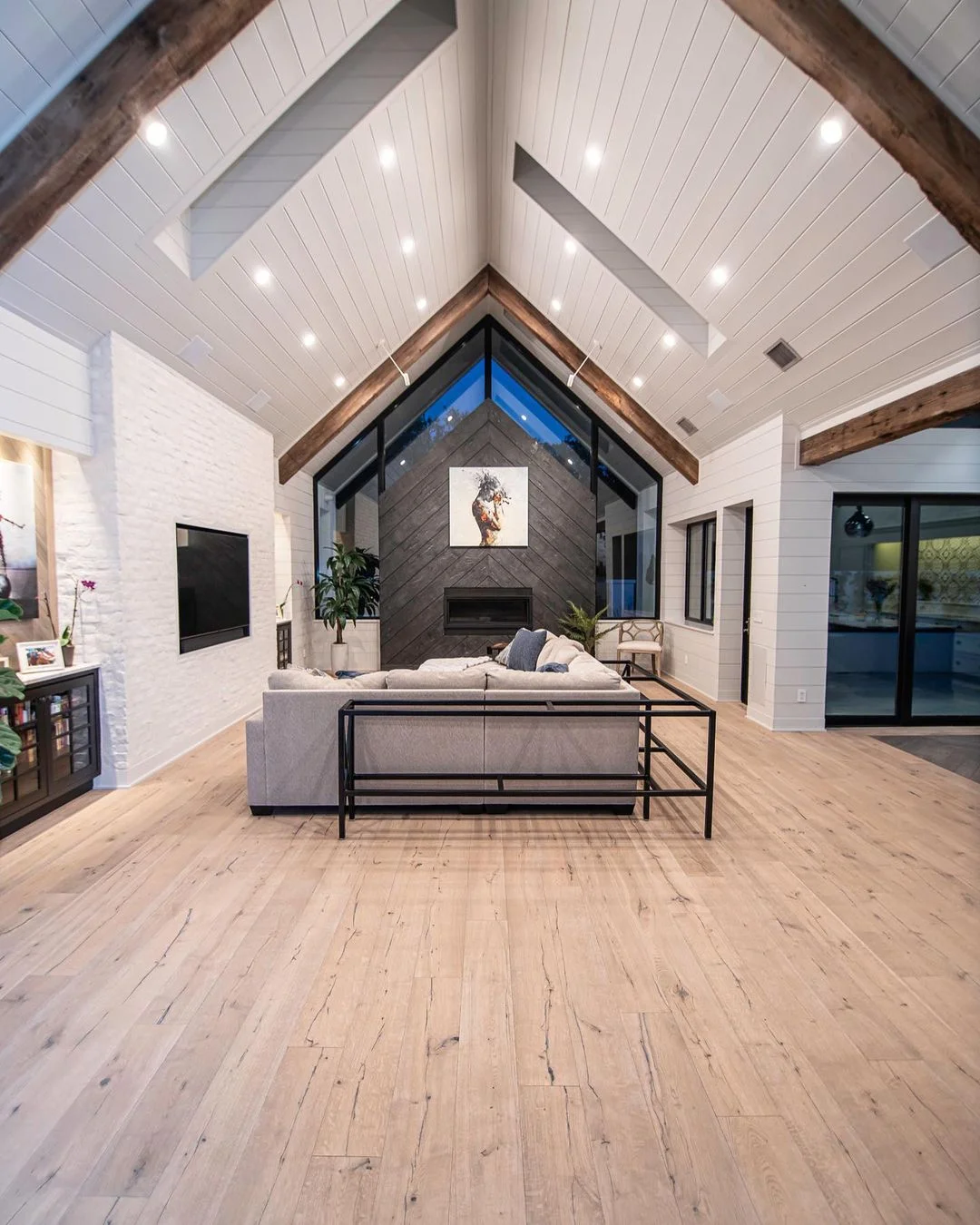 Spacious modern living room with vaulted ceiling.
